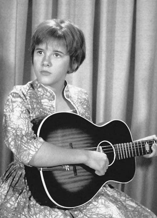 A young Stevie in 1965 with her first guitar.